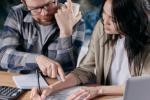 Couple calculating bills together
